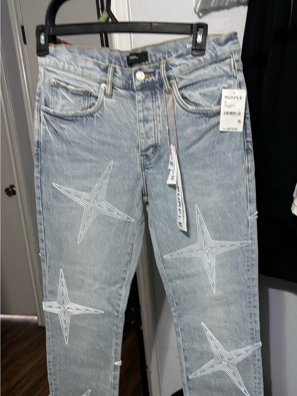 These are Purple Brand Men's Tuffetage Star Skinny Jeans in light indigo
